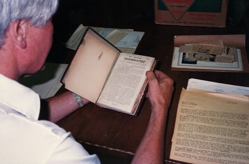 Del Bland inspecting the Carnegie Library copy of The Numismatist