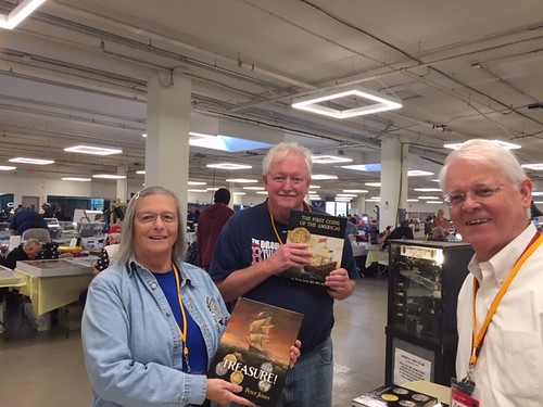 Book signing Peter Jones with two customers