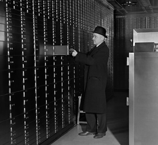 Man accessing safe deposit box 1930s