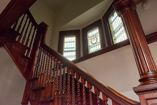 stairway with stained glass windows