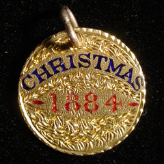 christmas 1884 Love token on type 3 $1 gold piece reverse