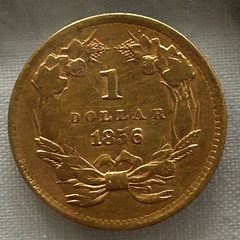 1856 gold dollar featuring EVERMAN counterstamp reverse