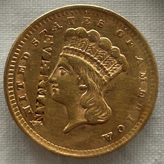 1856 gold dollar featuring EVERMAN counterstamp obverse