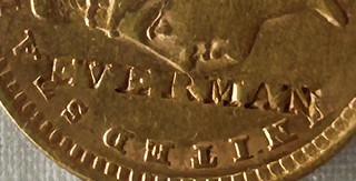 1856 gold dollar featuring EVERMAN counterstamp obverse