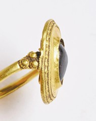 gold ring set with a garnet