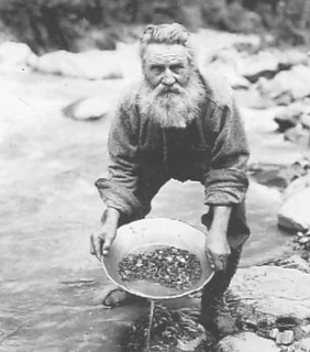 Prospector panning for gold