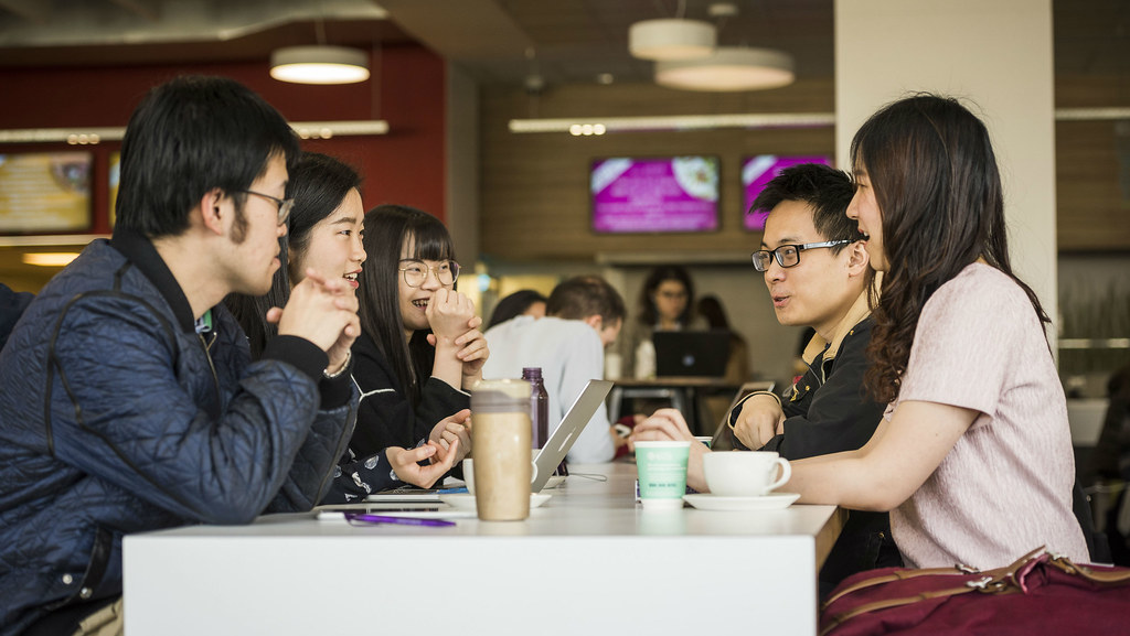 Pre-sessional students at reception desk