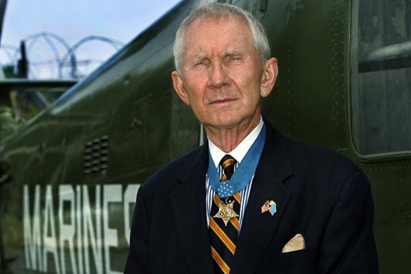 James Livingston stands wearing his Medal of Honor