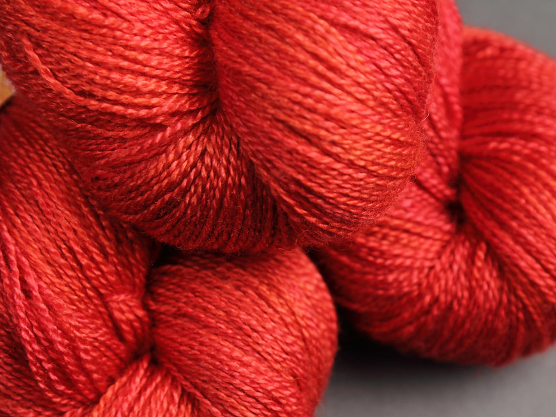 Brilliance Lace hand dyed yarn in 'Magma' (red-orange)