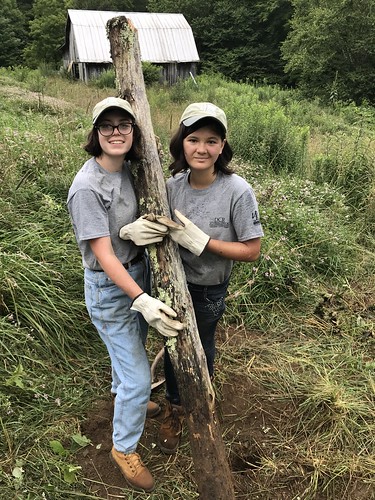 Two people worked together to dig up each post. Youth Conservation Corps Crew Leader: More than an Internship