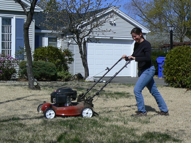 A person mowing