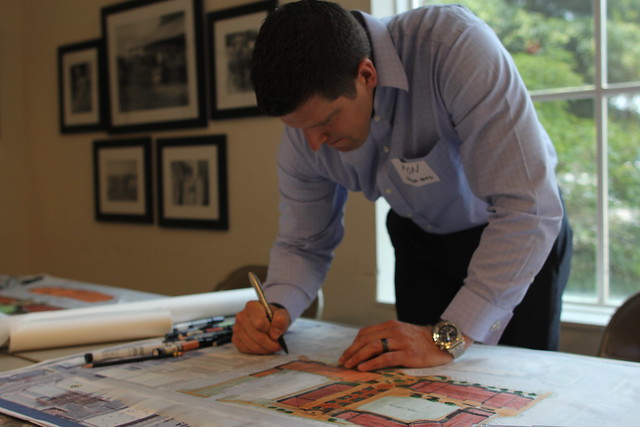 Architect Ron Batcher drawing plans for a downtown market