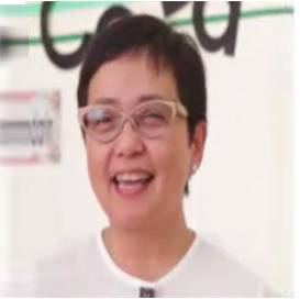 The image shows Ms. Gia Kuek wearing white shirt and eyeglasses with short hair.