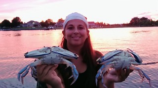 Photo of girl with her catch of blue crab
