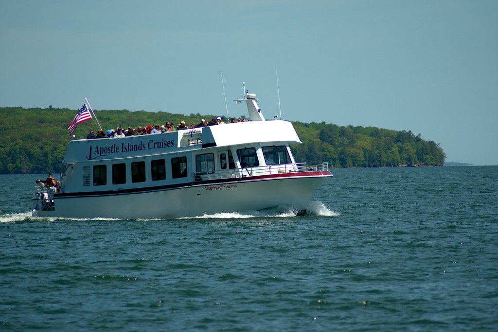 Apostle Island Cruises tour boat coming into Bayfield harbor, Wisconsin, June 5, 2018. Photo shared as public domain on Pixabay and Flickr as “Apostle Islands Tour Boat.”