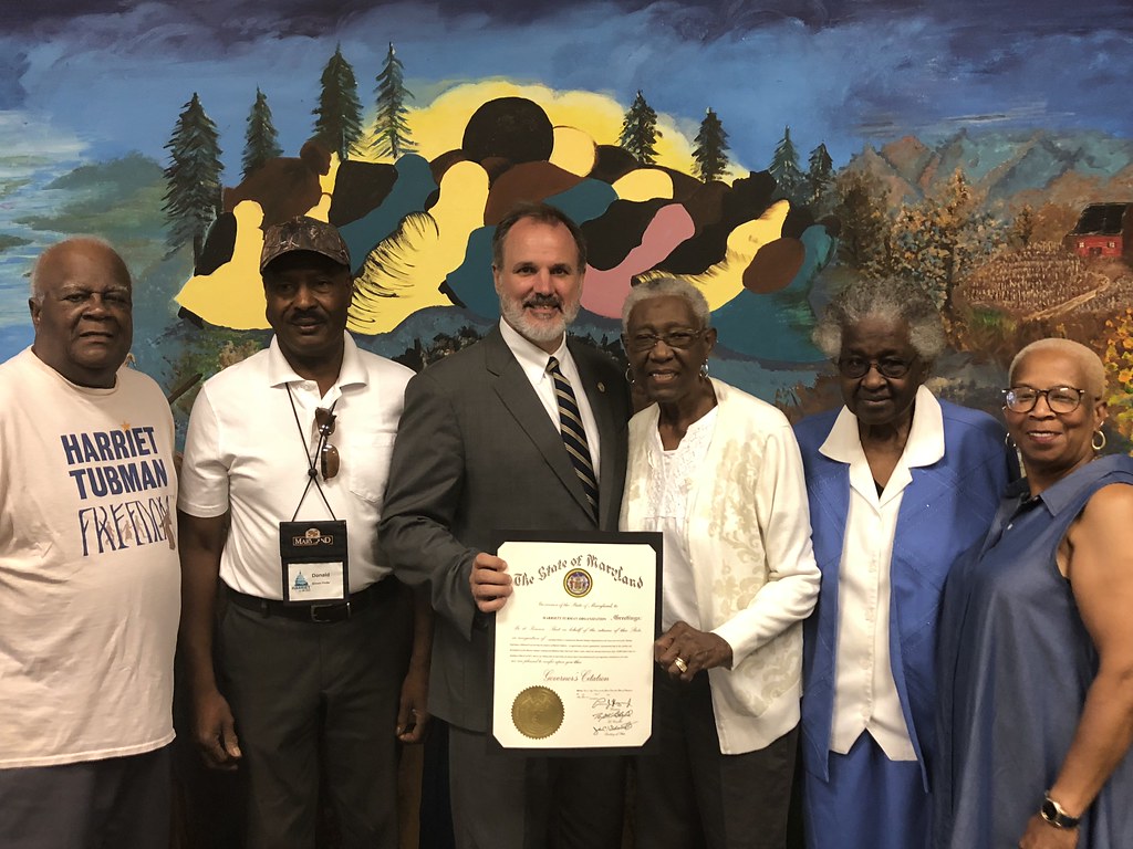 Photo of Secretary Belton presenting a governor's citation to the Harriet Tubman Organization.