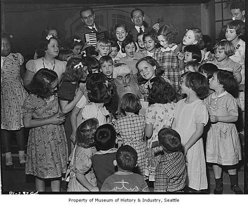 Santa Claus surrounded by children, Seattle, 1949 | Creator:… | Flickr