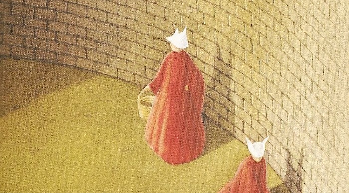 handmaid in red robes and white cap