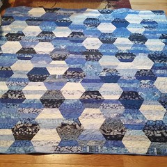 The Blue Hexie quilt is done! Feeling a great sense of accomplishment in completing this one. Made entirely from mom's stash.