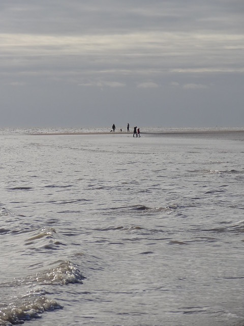 Sunday strollers enjoying the beach between Walton and Frinton