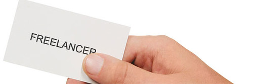 A business card with the word 'Freelancer' on it.