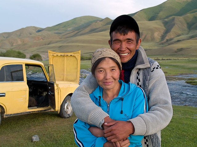 Kyrgyz couple | Before crossing river on that old car. On 