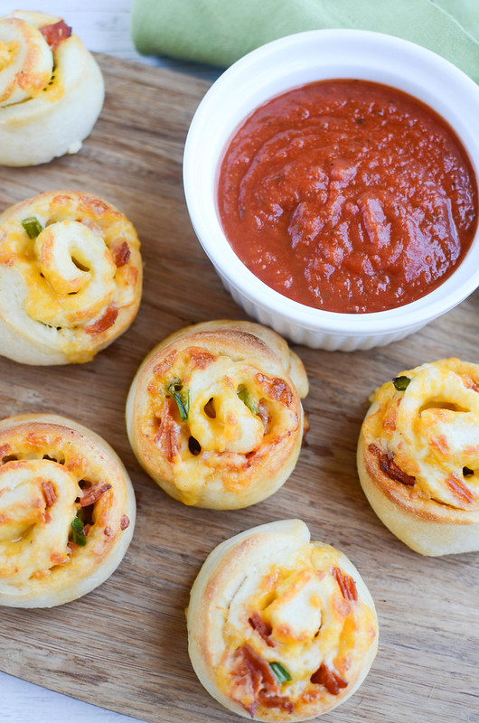 Ranch Pizza Rolls - easy snack or quick dinner idea! Ranch dressing, pepperoni, and cheese is rolled up in refrigerated pizza dough and baked until golden brown and delicious!