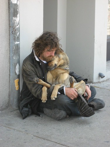 Homeless cuddling dog by Kirsten Starcher