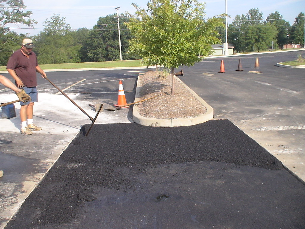 Installing Asphalt Surface | Two compacted layers of hot ...