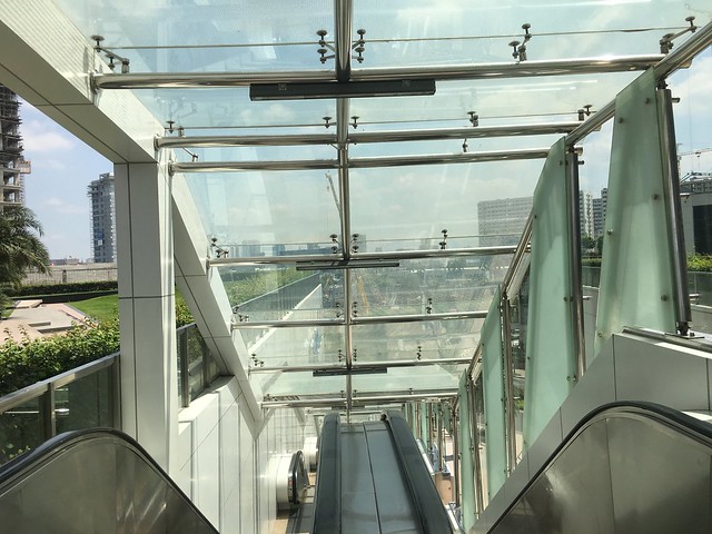 glass escalator walkway,  Prism Plaza