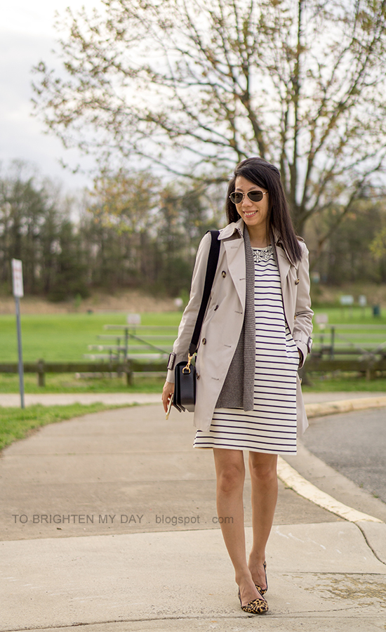 trench coat, taupe open cardigan sweater, striped dress with jeweled neckline, black shoulder bag, leopard flats