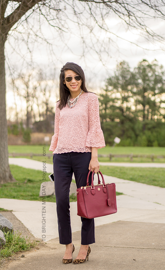 mixed pearl necklace, pink lace top with bell sleeves, navy ankle pants, burgundy tote, leopard pumps