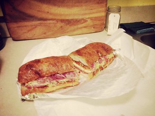 15 inch four meat grinder (sandwich) which contains capicola, mortadella, salami, soppresto, lettuce, pickled red onion, tomato, provalone, hot peppers, and more from Stachowski's in Georgetown