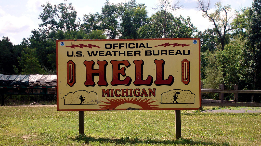 Sign on County highway D-32 in Hell, Michigan, United States, locating the official U.S. weather station in Hell. June 22, 2007