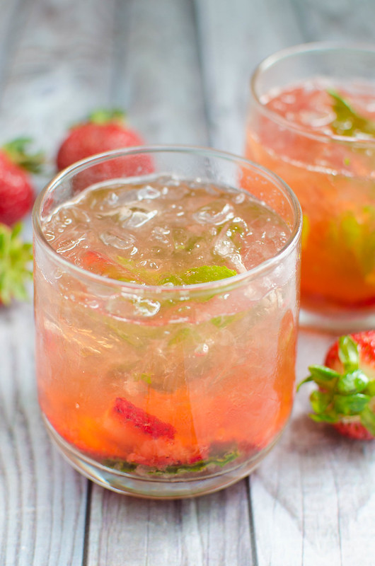 Strawberry Basil Bourbon Smash - juicy strawberries and fresh basil are the perfect pair in this bourbon cocktail recipe!