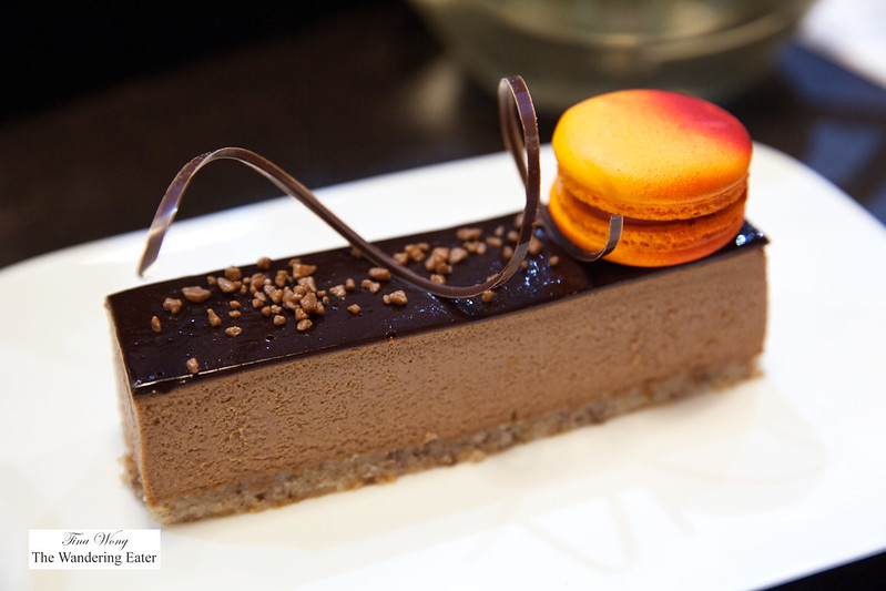 Earl grey mousse and chocolate cake with blood orange macaron