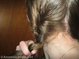 Beginning of the braid when making two braids - 12 hiking hairstyles that are pretty & practical