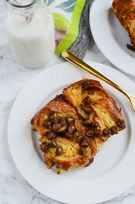Chocolate Chip Croissant Bread Pudding - the most decadent breakfast (or dessert)! Sliced croissants in sweet custard with chocolate chips sprinkled in!