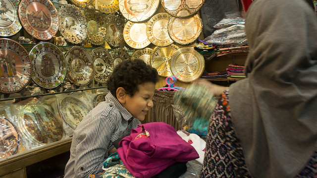A customer smiling in Khan El-Khalili shop