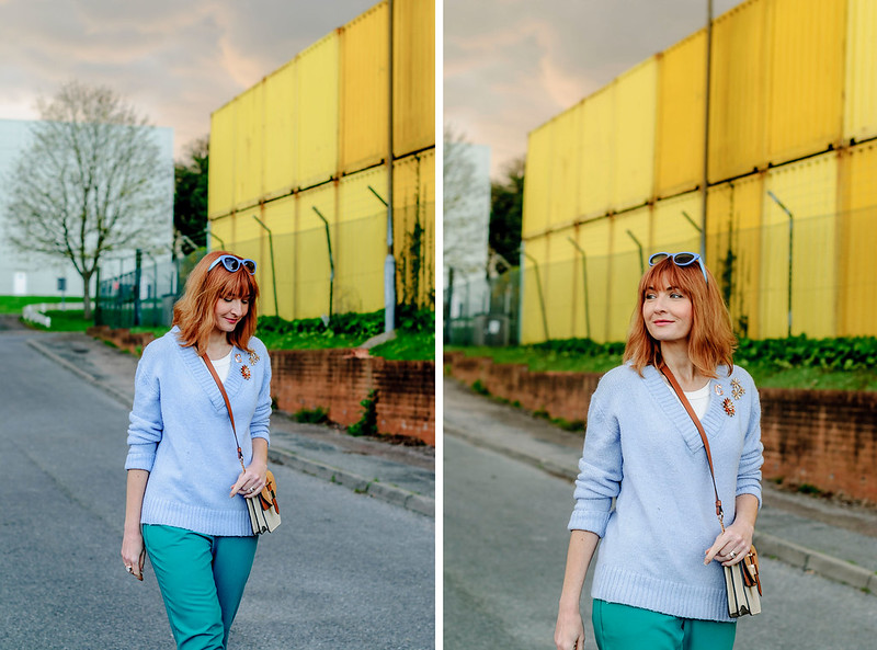 Spring look: Pale blue sweater emerald green peg trousers flower brooches tan strappy block heeled sandals two tone cross body bag | Not Dressed As Lamb, over 40 style