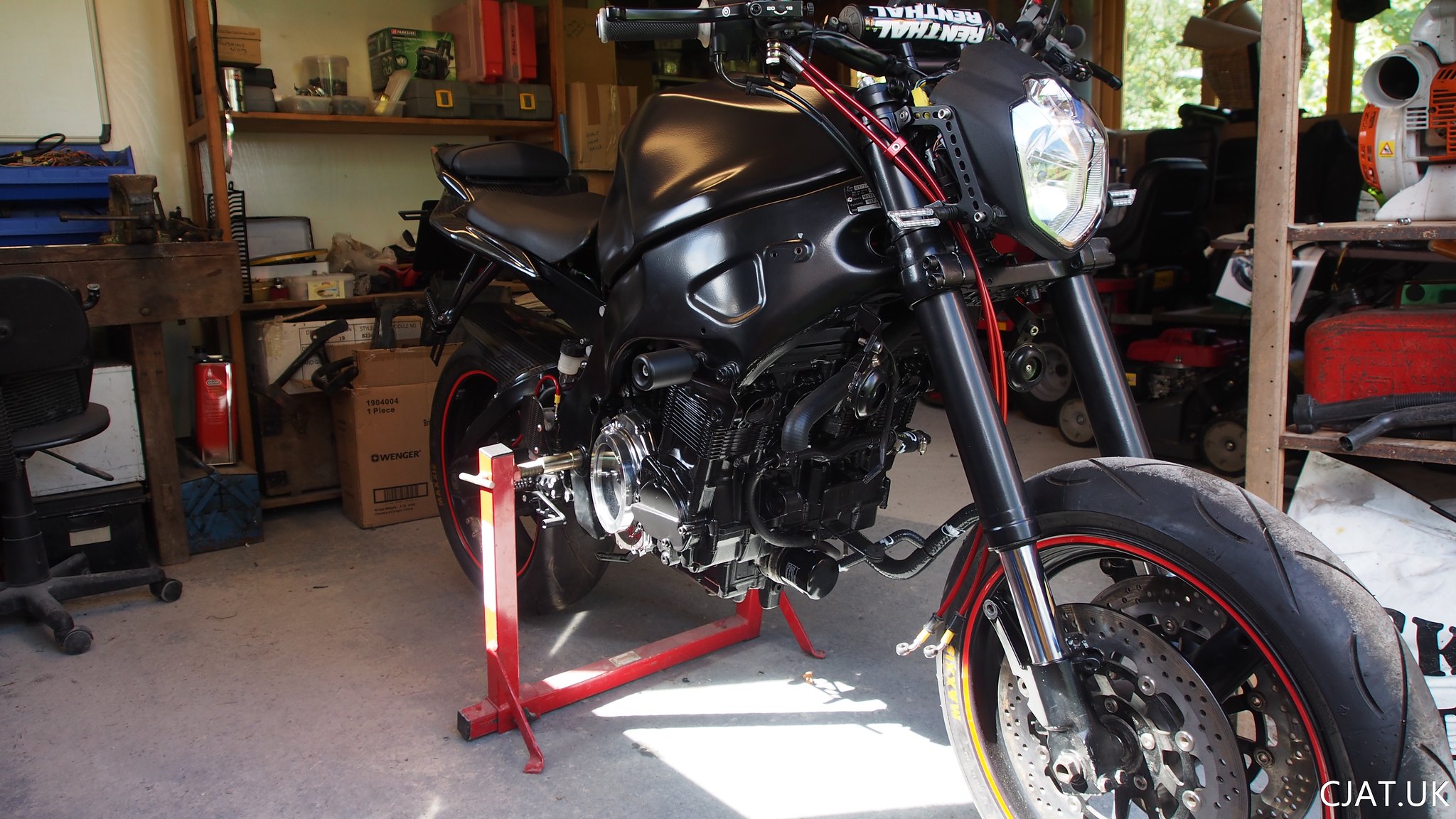 suzuki rf900 braided brake lines and new headlight with USD forks from a gsxr1100