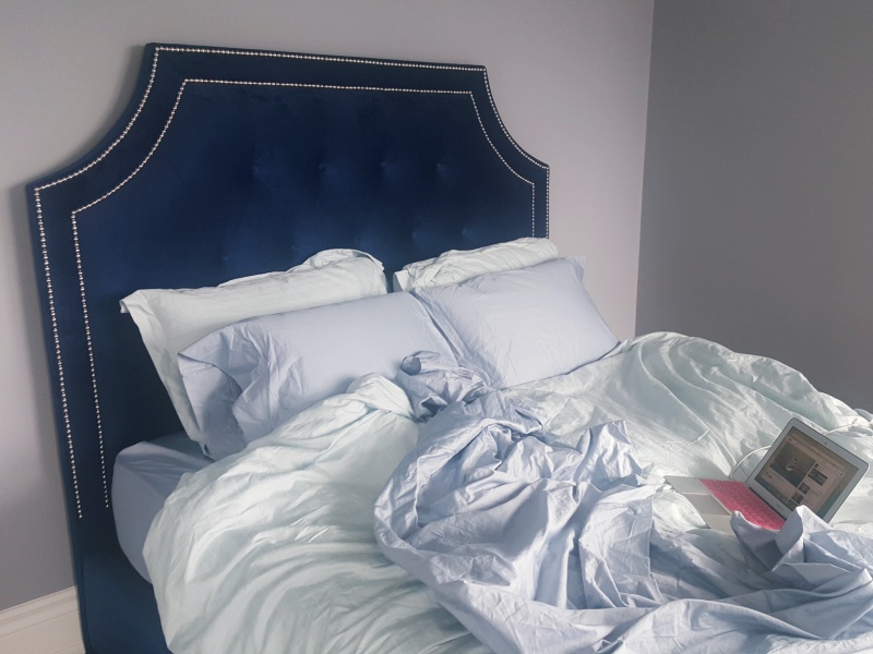 blue velvet upholstered bed