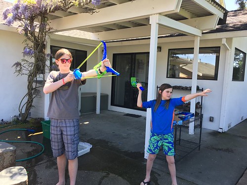 Nick with his water balloon bow and Sequoia with his water balloon atlatl
