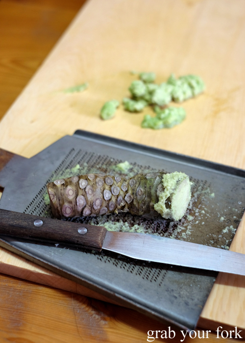 Fresh wasabi root on an oroshigane copper grater at Masaaki's Sushi in Geeveston, Tasmania