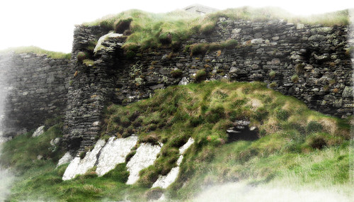 Stone wall of castle ruins at Galley Head in Ireland painted in the photo app Pixlromatic (Ireland)