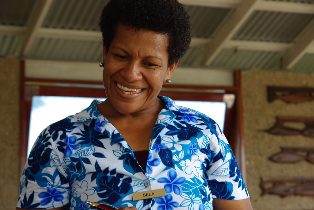 A Fijian woman wearing a traditional ‘Bula Shirt’