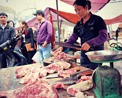 Selling pork in a traditonal Vietnamese market