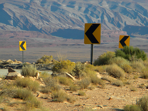 One of a hundred warnings about sharp turns ahead on Moki Dugway, a gravel road with lots of hairpin turns (Arizona, USA)