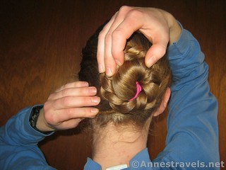 Keep winding the braid around the bun - 12 Pretty & Practical Hiking Hairstyles