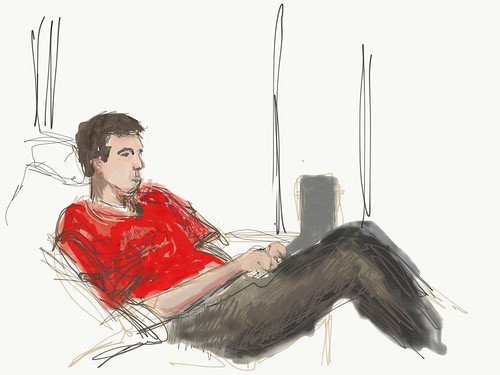M on couch with Chromebook